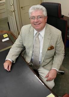 Jack Hamilton sitting at a desk